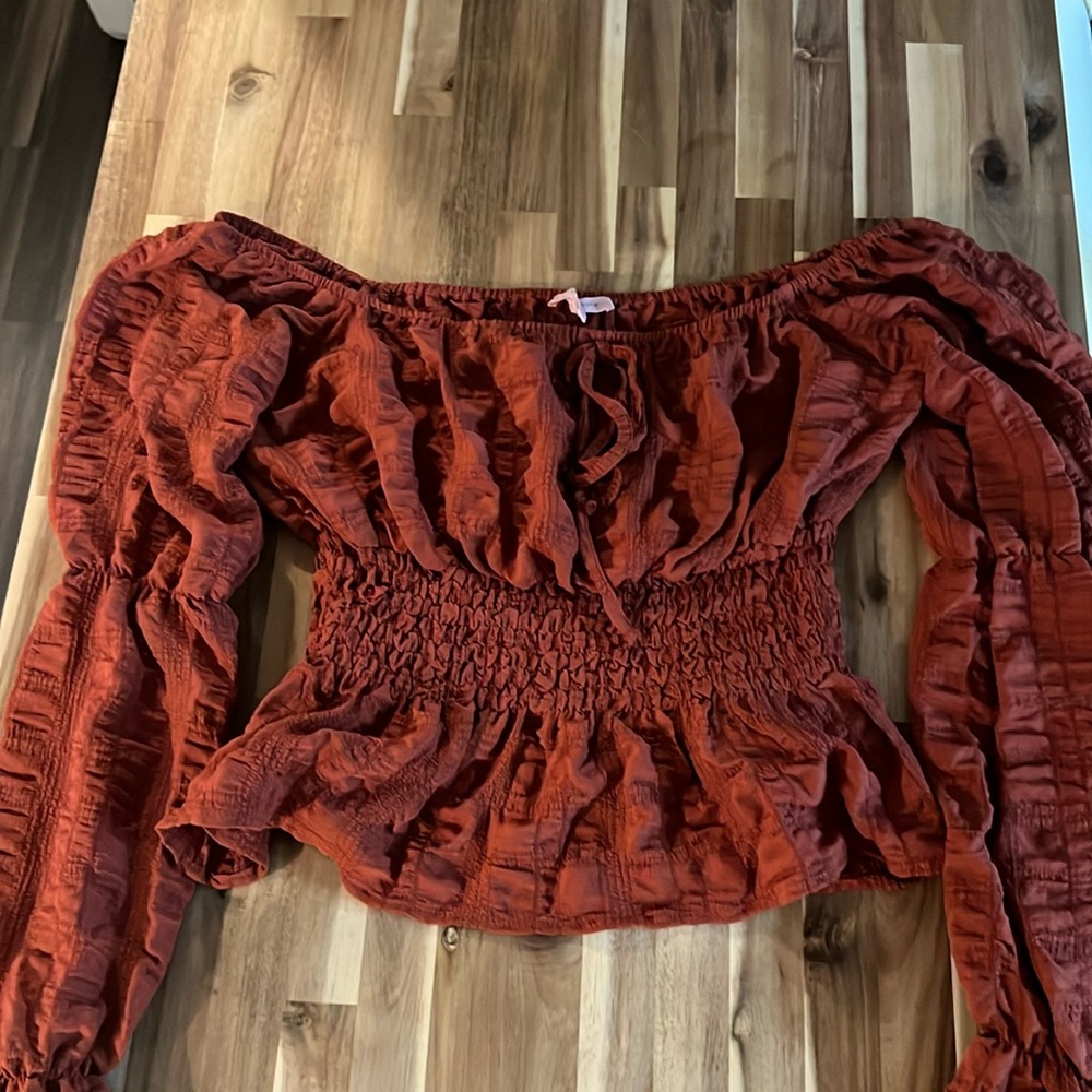 Woman’s Rust color, crop, long sleeve size M. Never worn